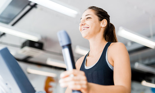 woman using the elliptical trainer